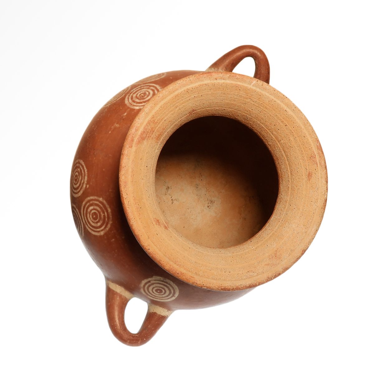 The mouth of the olla seen from above, showing the flaring rim and the pale interior of the vessel.